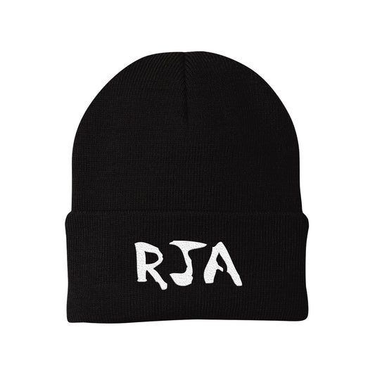 A stylish black beanie featuring The Red Jumpsuit Apparatus bold white logo in stylized letters on the front.